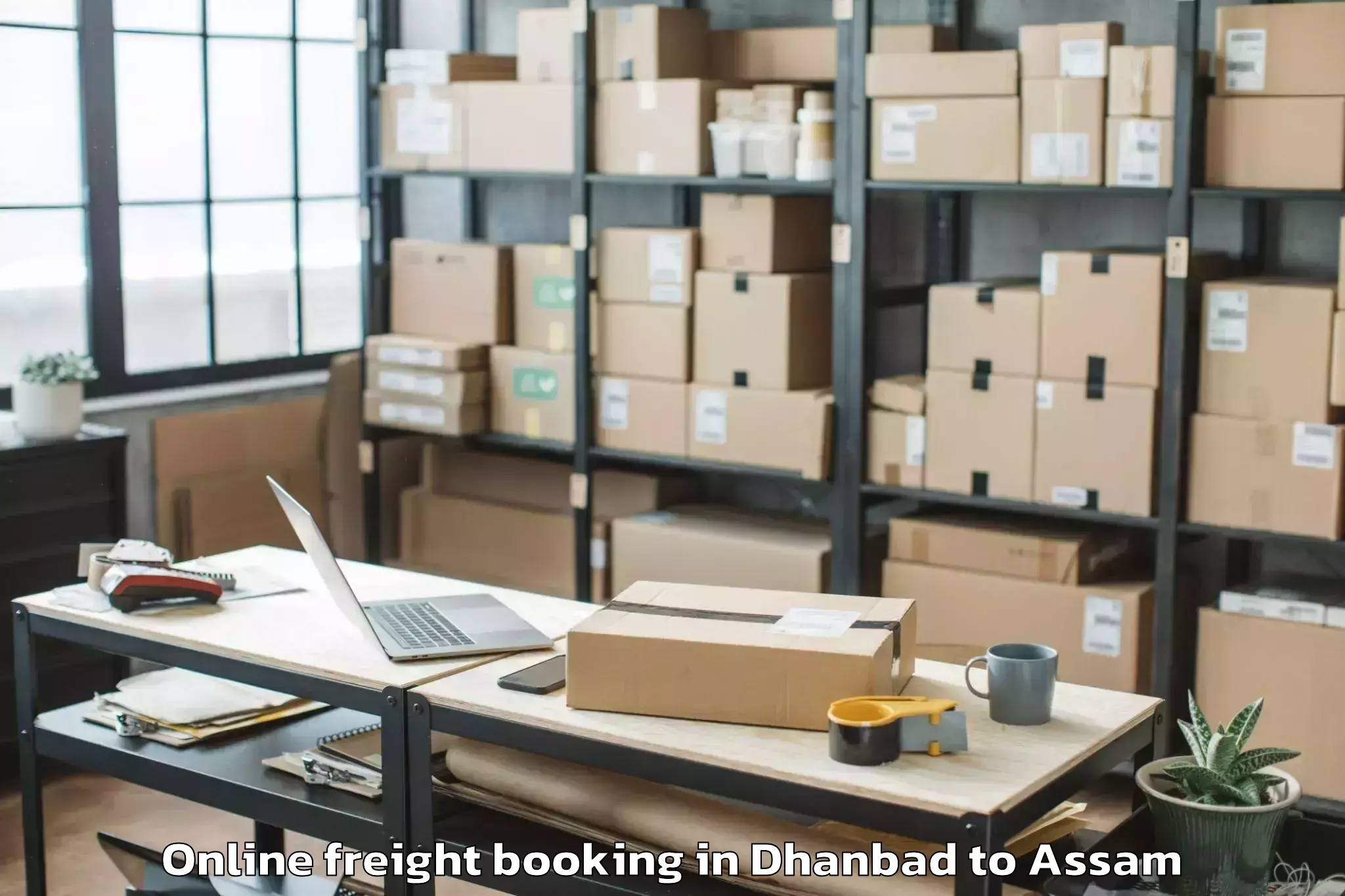 Book Dhanbad to Soalkuchi Online Freight Booking